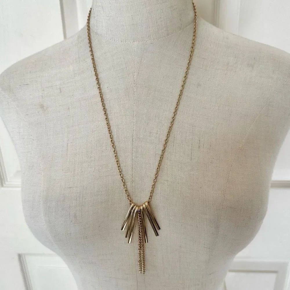 Gold tone long rod and chain pendant necklace